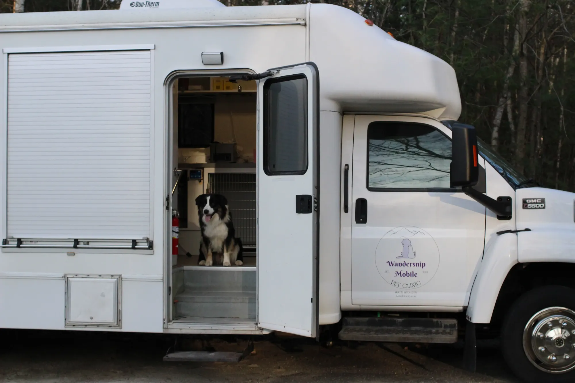 Mobile veterinary truck with dog